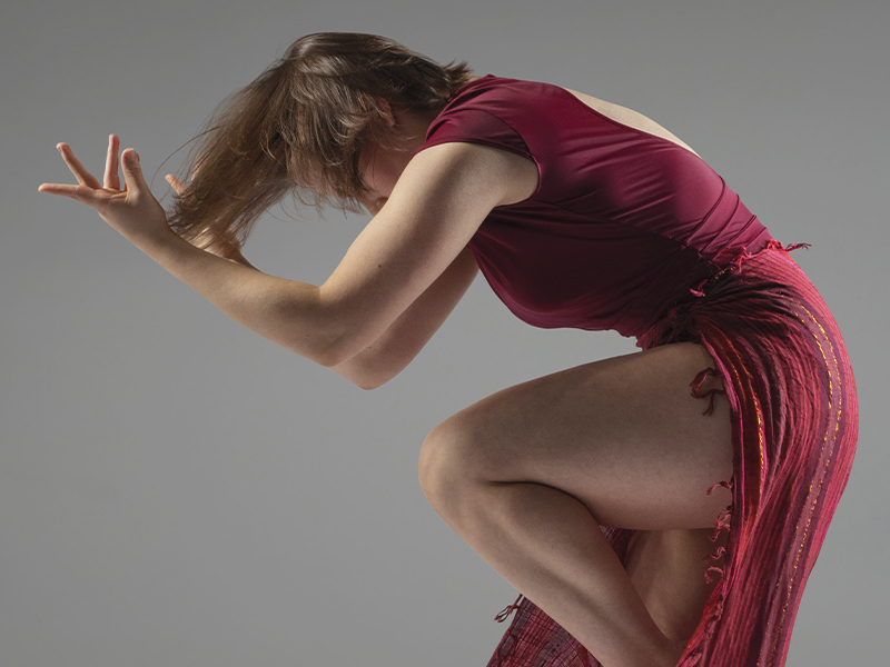 Ottawa Dance Centre School - Camille Lacroix St-Onge in contemporary ballet post wearing burgundy and red costume
